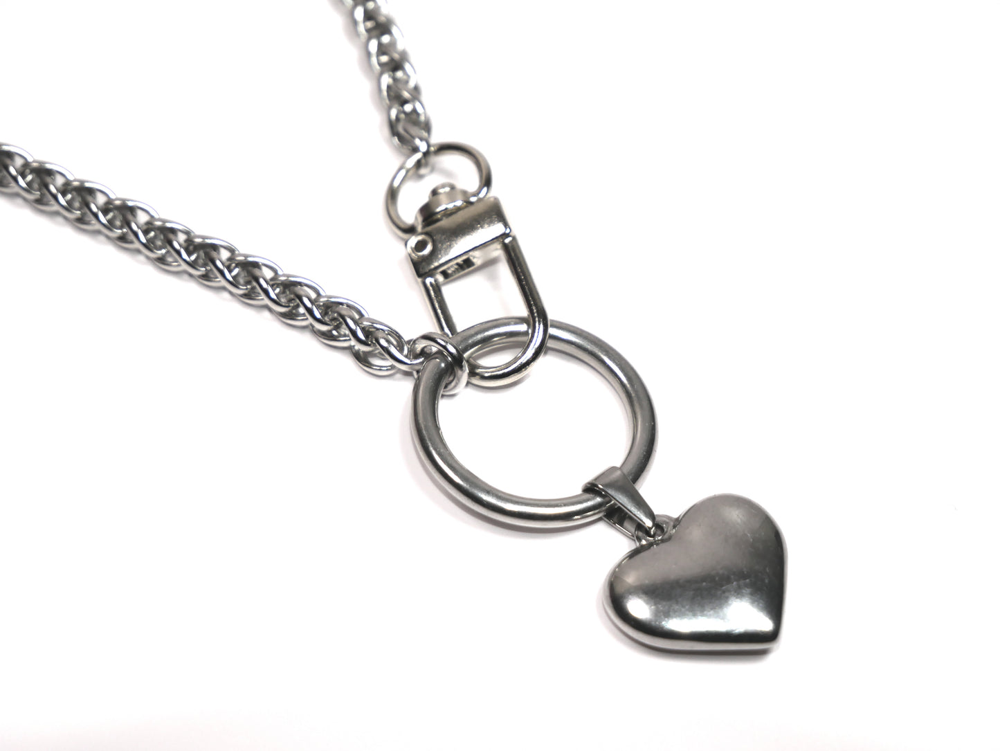 Silver necklace with a heart-shaped pendant on a white background. Devotion Clasp Collar with Heart to Heart pendant. Handcrafted biblical womanhood jewelry USA.