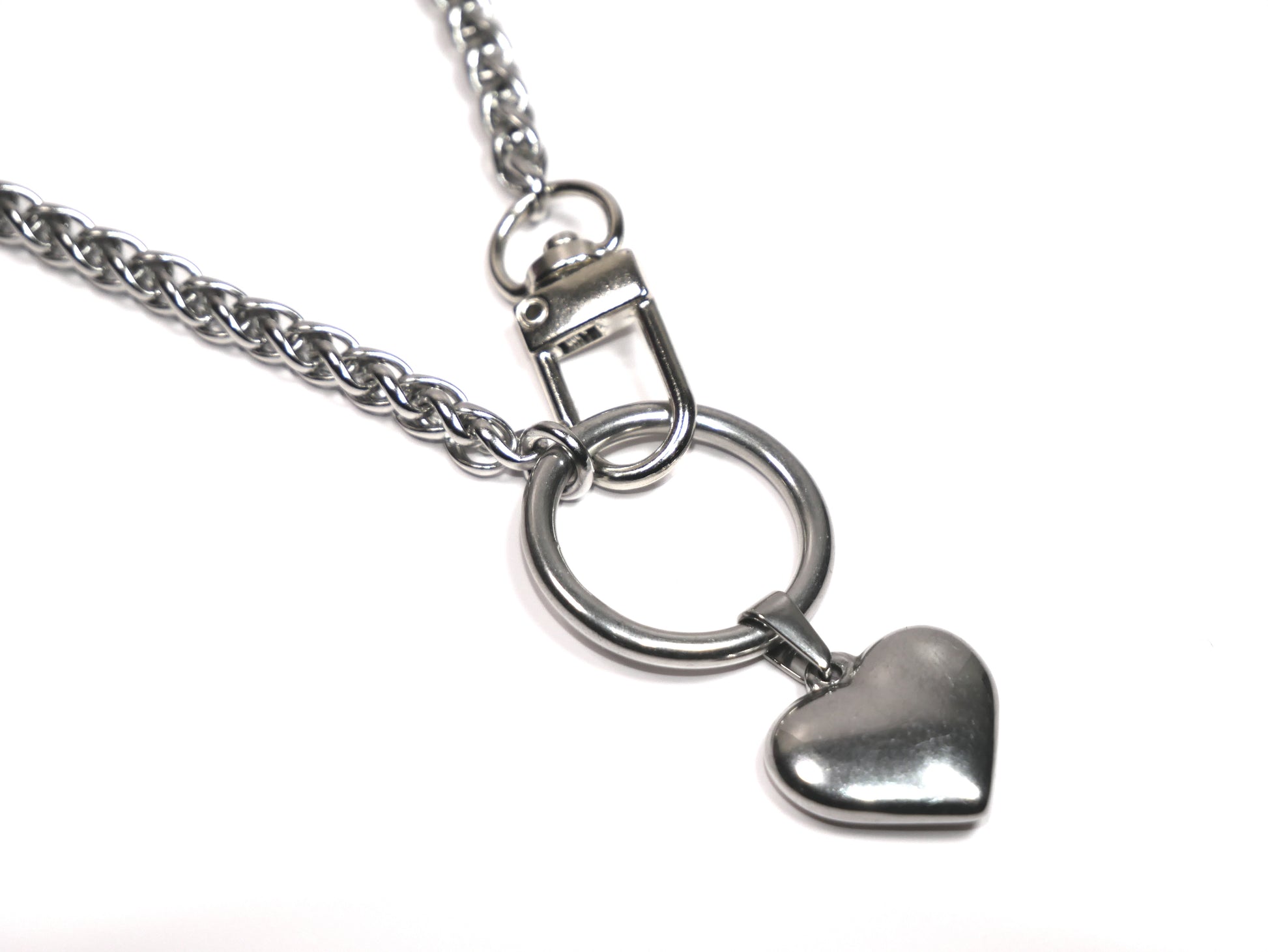 Silver necklace with a heart-shaped pendant on a white background. Devotion Clasp Collar with Heart to Heart pendant. Handcrafted biblical womanhood jewelry USA.